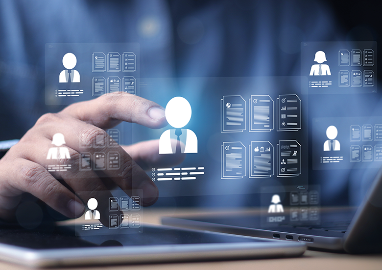 Photo-illustration showing a person interacting with a transparent digital interface displaying multiple user profile icons and document icons, symbolizing identity management. The interface includes white silhouette avatars with business attire and various document thumbnails, highlighting digital organization and selection processes.